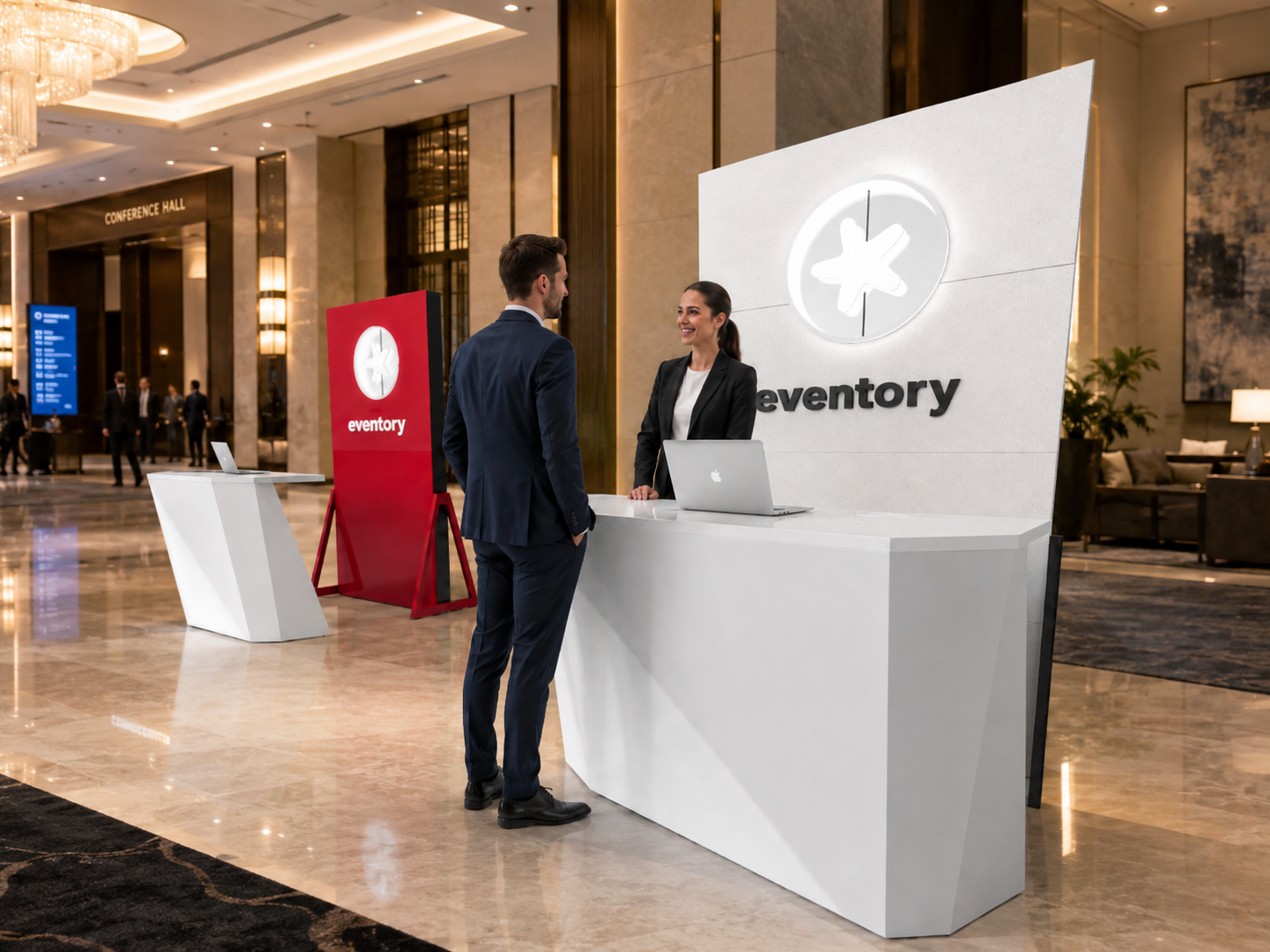 Eventory exhibition stand with a white reception desk and illuminated brand wall