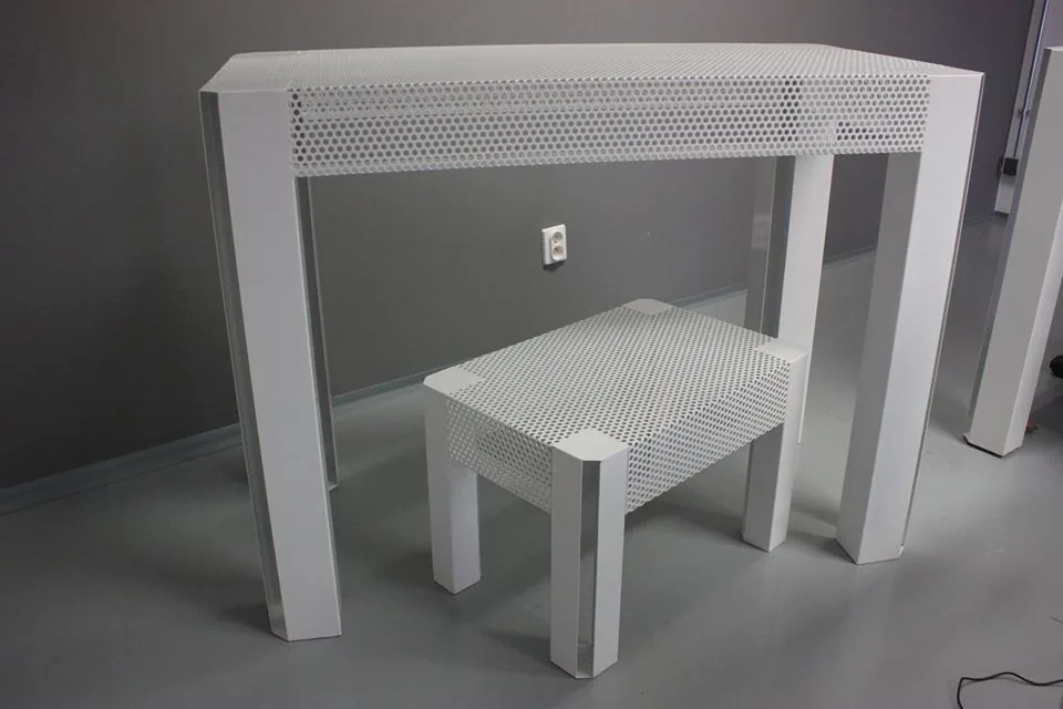 Custom powder-coated perforated steel showroom furniture