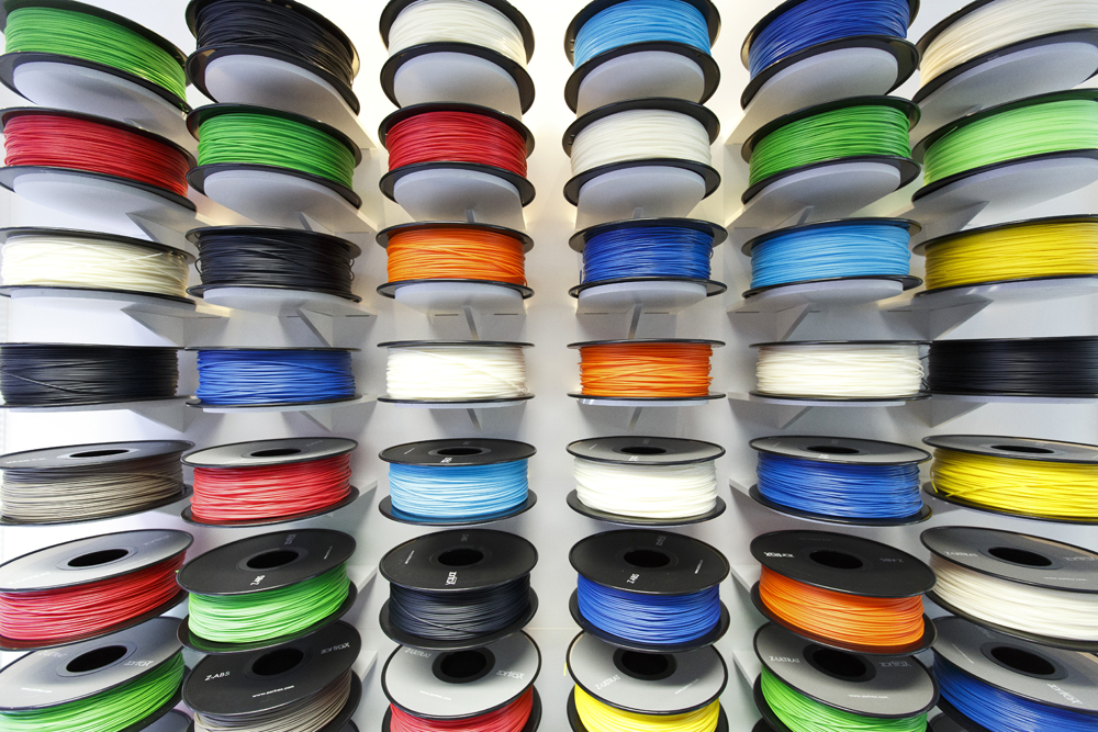 Close-up of colourful 3D printing filament spools